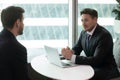 Confident male hr manager holding interview with young job seeker. Royalty Free Stock Photo