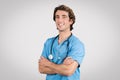 Confident male nurse in scrubs with folded arms Royalty Free Stock Photo