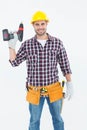 Confident male repairman holding drill machine Royalty Free Stock Photo