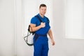 Confident Male Worker Carrying Pesticide Container Royalty Free Stock Photo