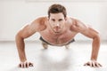 Confident man doing push-ups. Royalty Free Stock Photo