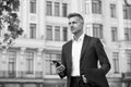 Confident man formal outfit. modern life concept. businessman on way to office. agile business. use phone while walking Royalty Free Stock Photo