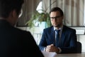 Confident man in glasses candidate waiting for hr manager decision