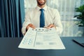 Confident man handing resume paper during job interview. Fervent Royalty Free Stock Photo