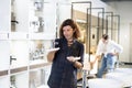 Confident man picking out new bathroom faucet in store Royalty Free Stock Photo