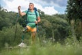 Confident man with prosthesis enjoying Nordic walking