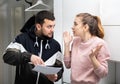 Man asking frustrated confused woman sign papers Royalty Free Stock Photo