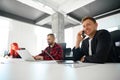 Confident man teamlead talking phone, arranging meeting with influential people Royalty Free Stock Photo