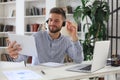 Confident man wearing headset speaking and watching business webinar training, listening to lecture Royalty Free Stock Photo