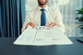 Confident man handing resume paper during job interview. Fervent Royalty Free Stock Photo