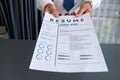Confident man handing resume paper during job interview. Fervent Royalty Free Stock Photo