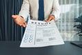 Confident man handing resume paper during job interview. Fervent Royalty Free Stock Photo