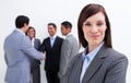 Confident manager with her team in the background Royalty Free Stock Photo