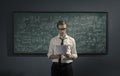 Confident math professor teaching in front of the chalkboard