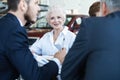 Confident mature business woman leader coach speaking at meeting negotiations Royalty Free Stock Photo