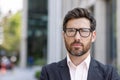 Confident mature businessman with beard in urban setting, corporate executive portrait Royalty Free Stock Photo