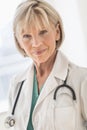 Confident Mature Female Doctor In Hospital Royalty Free Stock Photo