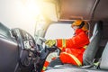 Confident mature fireman driving fire truck with communication interior view at station Royalty Free Stock Photo