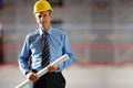 Confident mature male architect with a blueprint Royalty Free Stock Photo