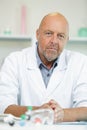 Confident mature man lab worker looks at camera Royalty Free Stock Photo