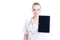 Confident medic or doctor woman showing blank screen display tab Royalty Free Stock Photo