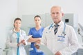 Confident medical team standing at dental clinic Royalty Free Stock Photo