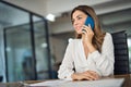 Confident mid aged business woman executive making phone call in office. Royalty Free Stock Photo