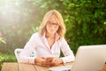 Confident middle aged woman working from home Royalty Free Stock Photo