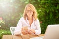 Confident middle aged woman working from home Royalty Free Stock Photo