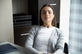 Confident millennial woman corporate employee practicing autotraining at office desk