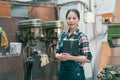 Confident milling machine factory female worker Royalty Free Stock Photo