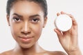 Confident mulatto girl prefers skincare treatment Royalty Free Stock Photo