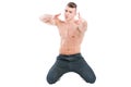 Confident muscular male model on his knees Royalty Free Stock Photo