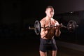 Confident muscular man training with barbell . Closeup portrait of professional bodybuilder workout with barbell at gym. Royalty Free Stock Photo