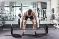 Confident muscular man training squats with barbells over head. Closeup portrait of professional man workout with barbell at gym. Royalty Free Stock Photo