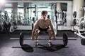 Confident muscular man training squats with barbells over head. Closeup portrait of professional man workout with barbell at gym. Royalty Free Stock Photo