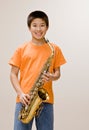 Confident musician holding saxophone