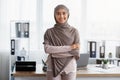Confident Muslim Businesswoman Standing With Folded Arms Near Workplace In Office Royalty Free Stock Photo