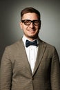 Confident nerd in eyeglasses and bow tie