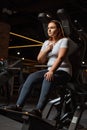 Confident overweight girl looking away while sitting