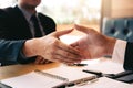 Confident partnerships people shaking hands with making a contract in the office Royalty Free Stock Photo