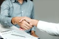 Confident partnerships people shaking hands with making a contract in the office Royalty Free Stock Photo