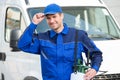 Confident Pest Control Worker Wearing Cap Against Truck