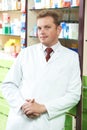 Confident pharmacy chemist man in drugstore Royalty Free Stock Photo