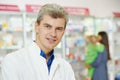 Confident pharmacy chemist man in drugstore Royalty Free Stock Photo