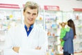 Confident pharmacy chemist man in drugstore Royalty Free Stock Photo