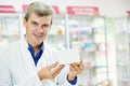 Confident pharmacy chemist man in drugstore Royalty Free Stock Photo