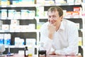 Confident pharmacy chemist man in drugstore Royalty Free Stock Photo