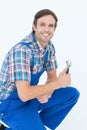 Confident plumber holding adjustable wrench Royalty Free Stock Photo