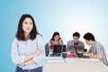 Confident pretty entrepreneur stands with her team Royalty Free Stock Photo